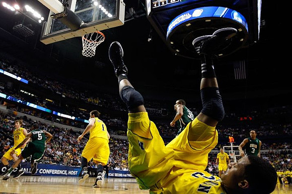 Evan Smotrycz (23), Stu Douglass (1), Trey Burke (3), and Jordan Morgan (52)