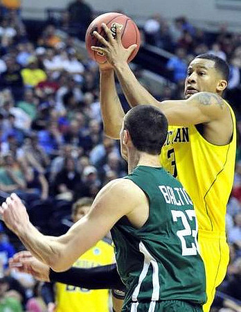 Evan Smotrycz (23) and Trey Burke (3)