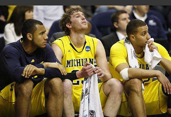 Jon Horford (15), Evan Smotrycz (23), and Jordan Morgan (52)