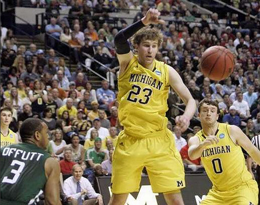 Stu Douglass (1), Evan Smotrycz (23), and Zack Novak (0)