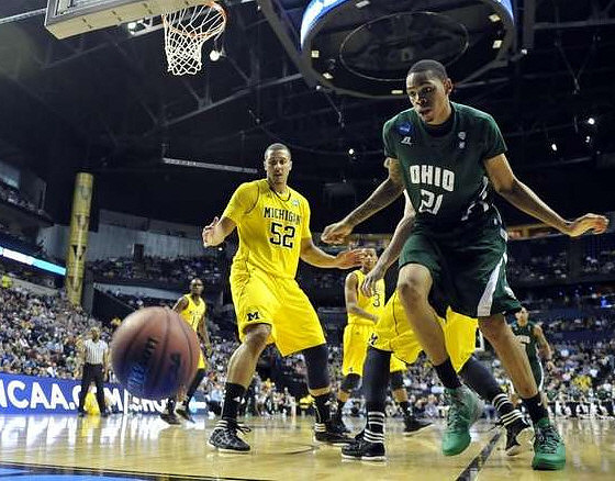Tim Hardaway Jr. (10), Jordan Morgan (52), and Trey Burke (3)