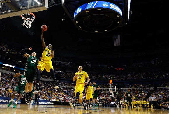 Tim Hardaway Jr. (10), Jordan Morgan (52), and Trey Burke (3)