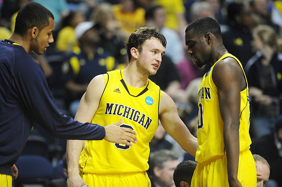Jon Horford (15), Zack Novak (0), and Tim Hardaway Jr. (10)