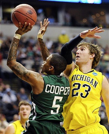 Zack Novak (0) and Evan Smotrycz (23)