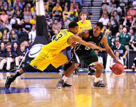 Trey Burke (3) and Evan Smotrycz (23)