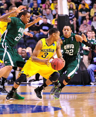 Jordan Morgan (52) and Trey Burke (3)