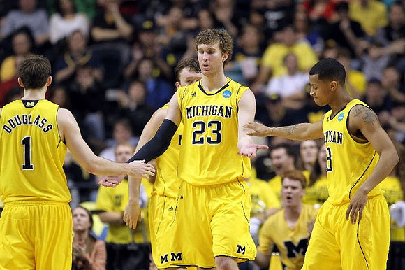 Stu Douglass (1), Zack Novak (0), Evan Smotrycz (23), and Trey Burke (3)