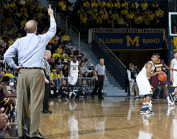 John Beilein, Tim Hardaway Jr. (10), Trey Burke (3), and Evan Smotrycz (23)