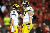 Russell Bellomy (8) and Taylor Lewan (77)