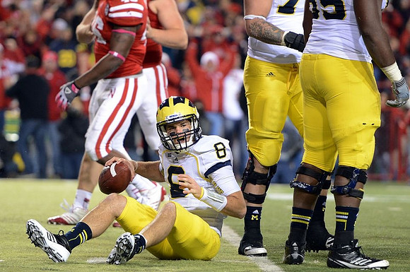 Russell Bellomy (8), Taylor Lewan (77), and Patrick Omameh (65)
