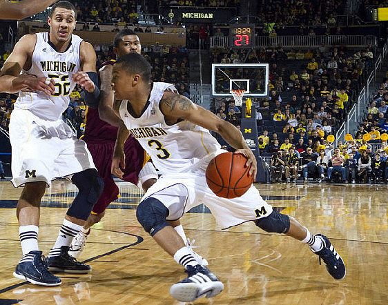 Jordan Morgan (52) and Trey Burke (3)