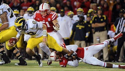 Taylor Lewan (77) and Russell Bellomy (8)