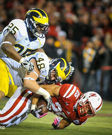 Kenny Demens (25) and Desmond Morgan (48)