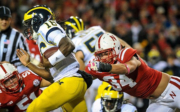 Denard Robinson (16) and Elliott Mealer (57)