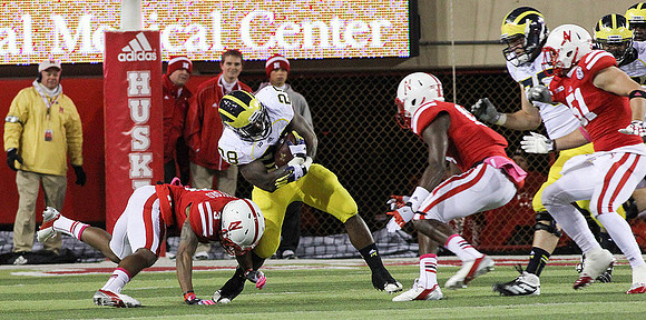 Fitzgerald Toussaint (28) and Michael Schofield (75)