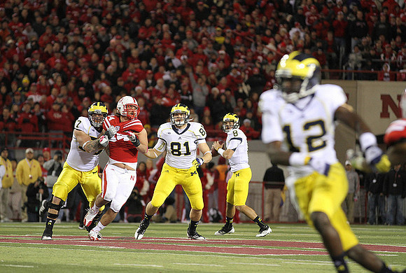 Taylor Lewan (77), Mike Kwiatkowski (81), Russell Bellomy (8), and Devin Gardner (12)
