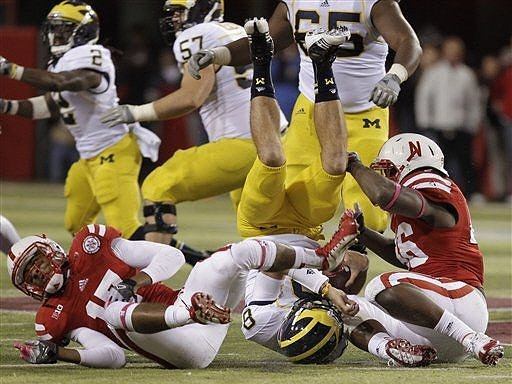 Vincent Smith (2), Elliott Mealer (57), Patrick Omameh (65), and Russell Bellomy (8)