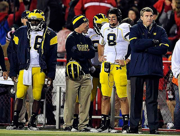 Denard Robinson (16), Russell Bellomy (8), and David Brandon