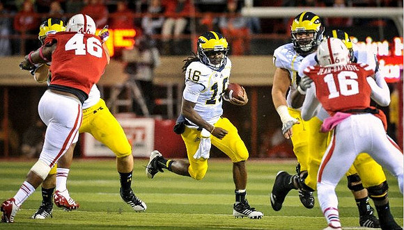 Denard Robinson (16) and Taylor Lewan (77)