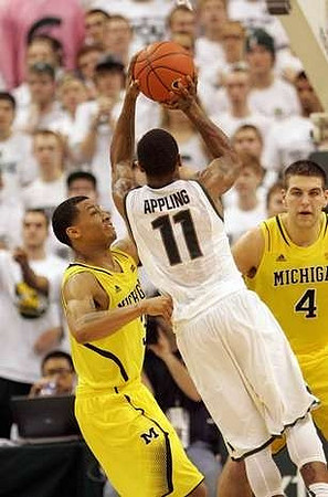 Trey Burke (3) and Mitch McGary (4)