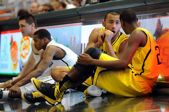Jon Horford (15) and Caris LeVert (23)