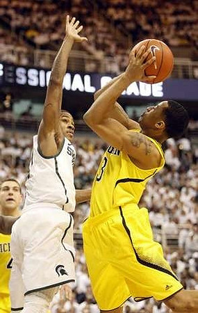 Trey Burke (3) and Mitch McGary (4)