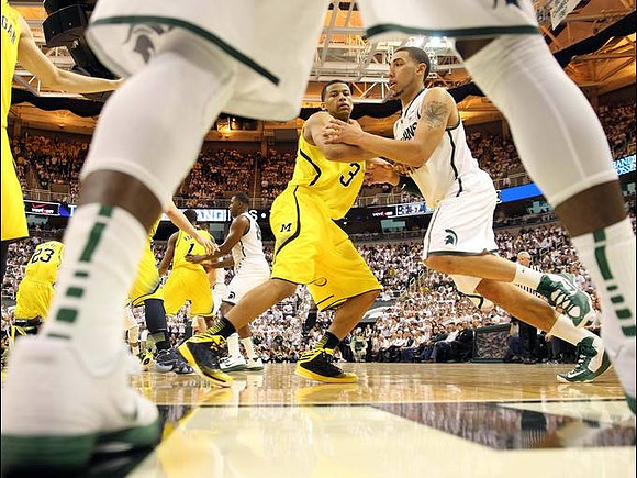 Trey Burke (3), Glenn Robinson III (1), and Caris LeVert (23)