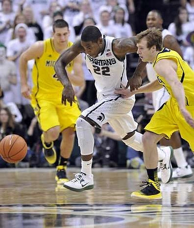 Mitch McGary (4) and Spike Albrecht (2)