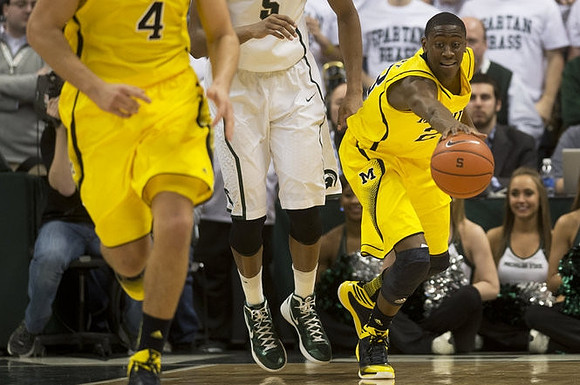 Mitch McGary (4) and Caris LeVert (23)