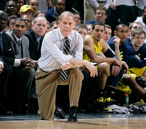 Bacari Alexander, LaVall Jordan, John Beilein, Jordan Morgan (52), Nik Stauskas (11), Jon Horford (15), Matt Vogrich (13), and Blake McLimans (22)