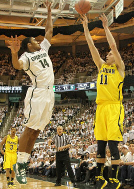 Trey Burke (3) and Nik Stauskas (11)