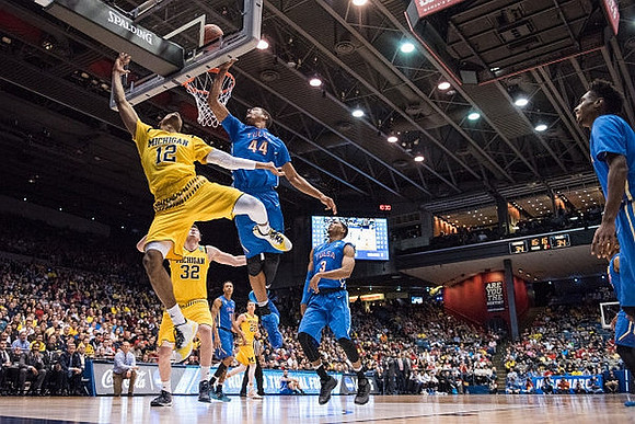 Muhammad-Ali Abdur-Rahkman (12), Ricky Doyle (32), and Duncan Robinson (22)