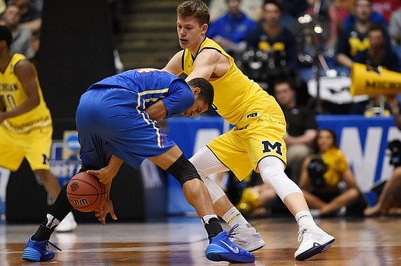 Derrick Walton Jr. (10) and Moritz Wagner (13)