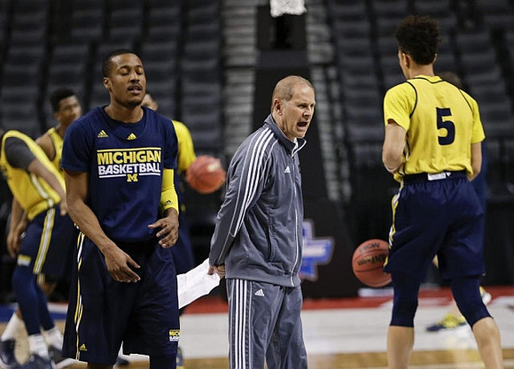 Muhammad-Ali Abdur-Rahkman (12), John Beilein, and D.J. Wilson (5)