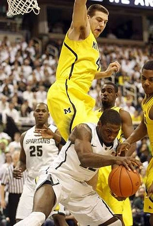 Mitch McGary (4), Tim Hardaway Jr. (10), and Trey Burke (3)