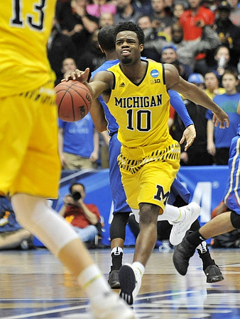 Moritz Wagner (13) and Derrick Walton Jr. (10)