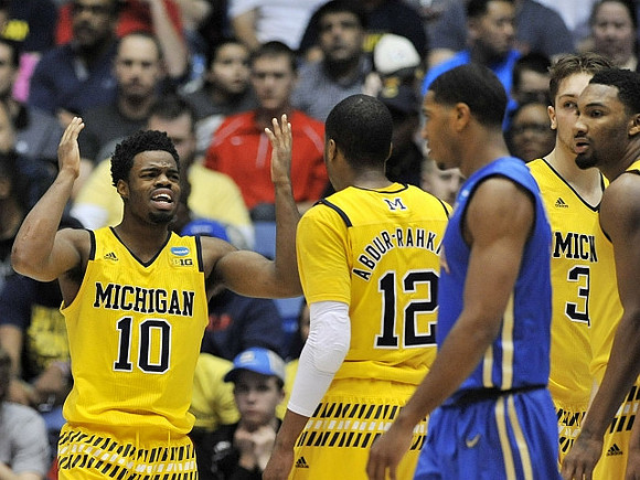 Derrick Walton Jr. (10), Muhammad-Ali Abdur-Rahkman (12), Mark Donnal (34), and Zak Irvin (21)