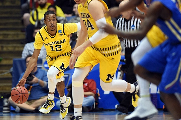 Muhammad-Ali Abdur-Rahkman (12) and Mark Donnal (34)