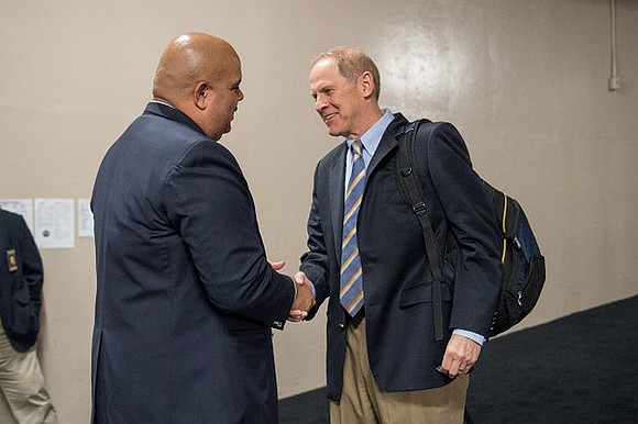 Michigan Athletic Director Warde Manuel and John Beilein
