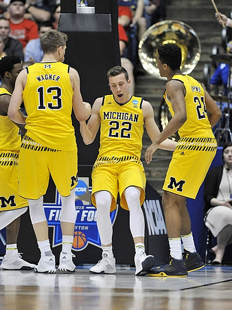 Moritz Wagner (13), Duncan Robinson (22), and Aubrey Dawkins (24)