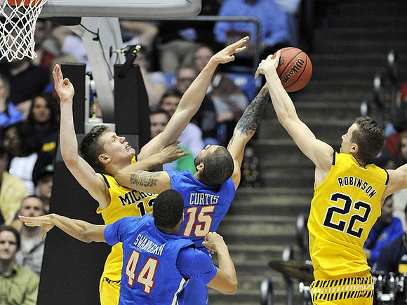 Moritz Wagner (13) and Duncan Robinson (22)