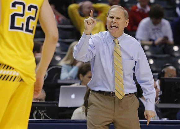 Duncan Robinson (22) and John Beilein