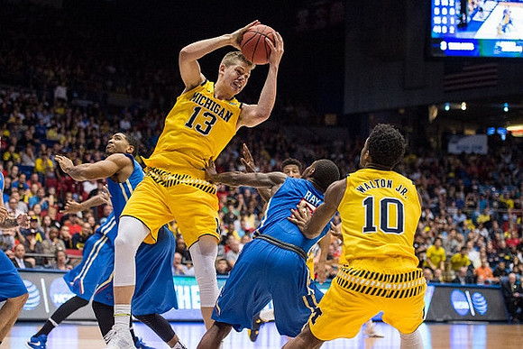 Moritz Wagner (13) and Derrick Walton Jr. (10)