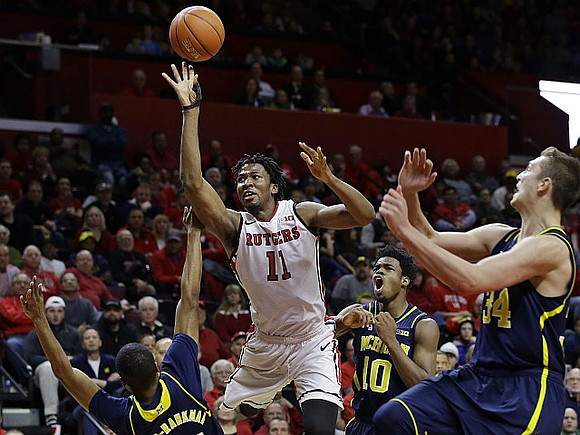 Muhammad-Ali Abdur-Rahkman (12), Derrick Walton Jr. (10), and Mark Donnal (34)