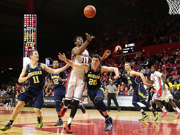 Andrew Dakich (11), Muhammad-Ali Abdur-Rahkman (12), Sean Lonergan (20), and Mark Donnal (34)