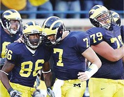 Mario Manningham, Chad Henne, and  Adam Stenavich