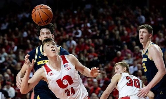 Brandon Johns Jr. (23) and Jon Teske (15)