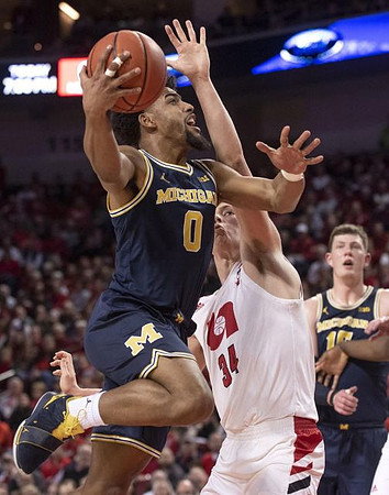 David DeJulius (0) and Jon Teske (15)