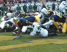 B.J. Askew (35) and Tim Massaquoi (88)