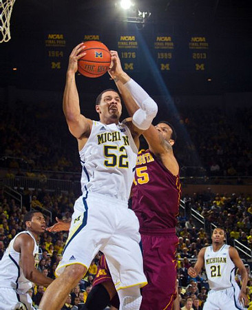 Glenn Robinson III (1), Jordan Morgan (52), and Zak Irvin (21)